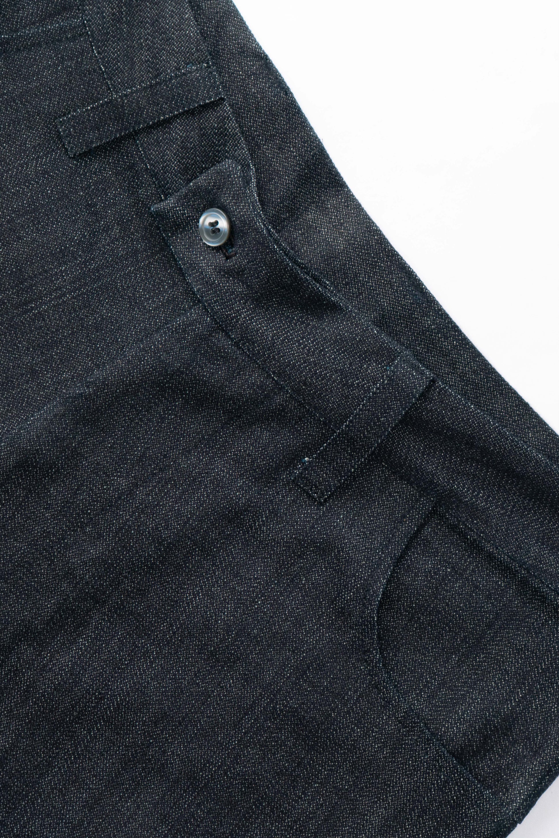 Dark indigo denim, waistband close-up