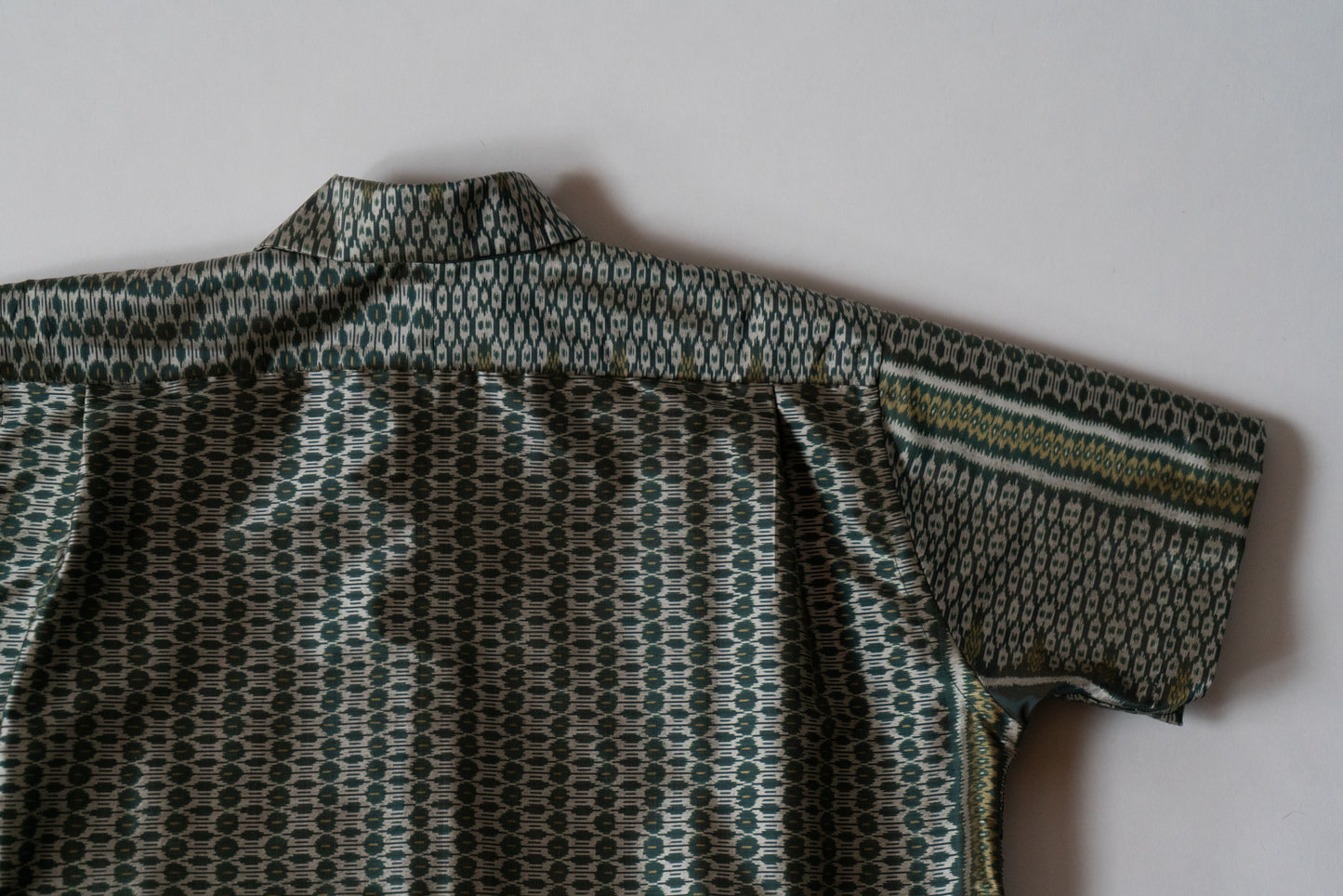 Green Cambodian silk button down, flat back view