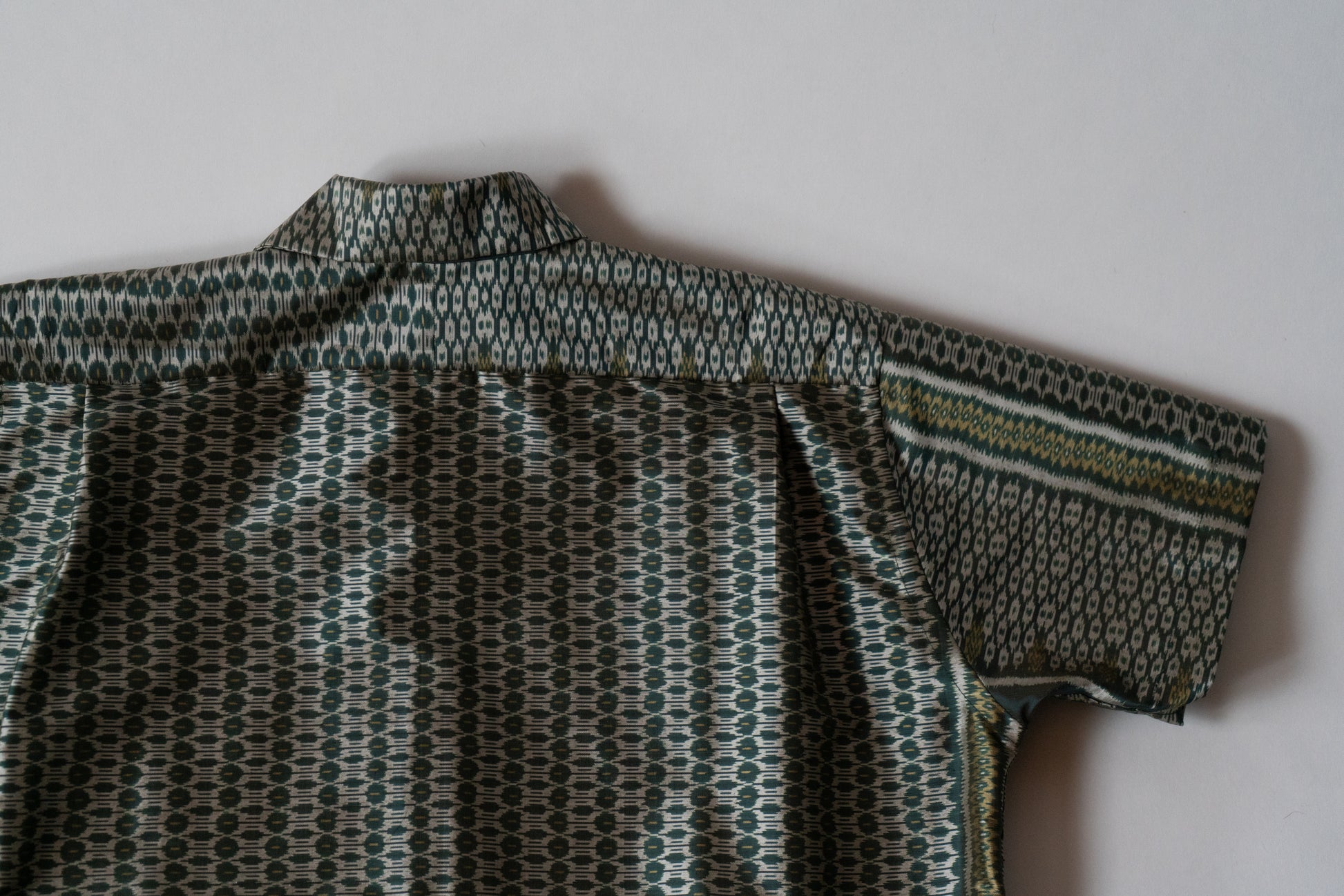 Green Cambodian silk button down, flat back view
