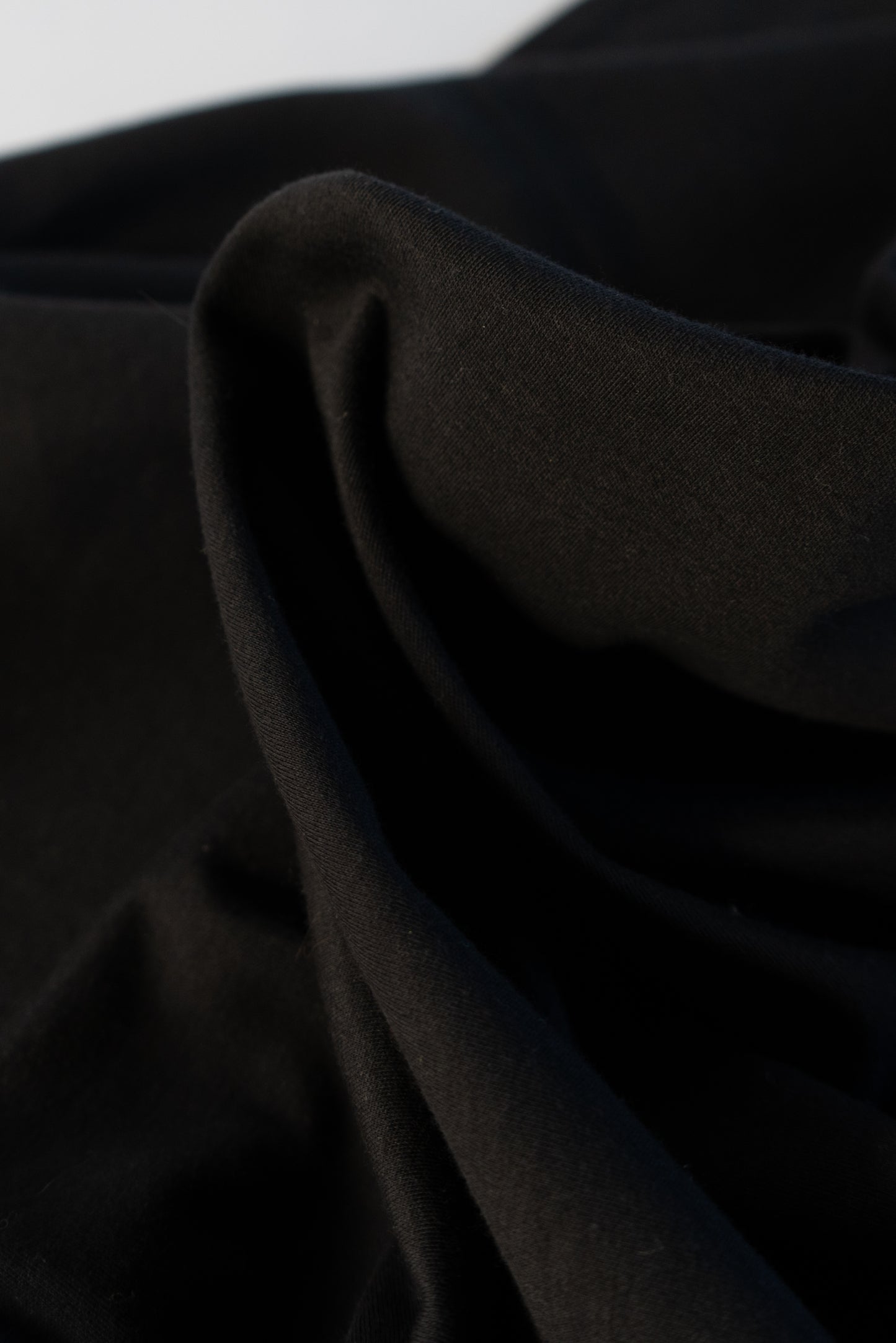 Close up of black jersey fabric for mens shirt